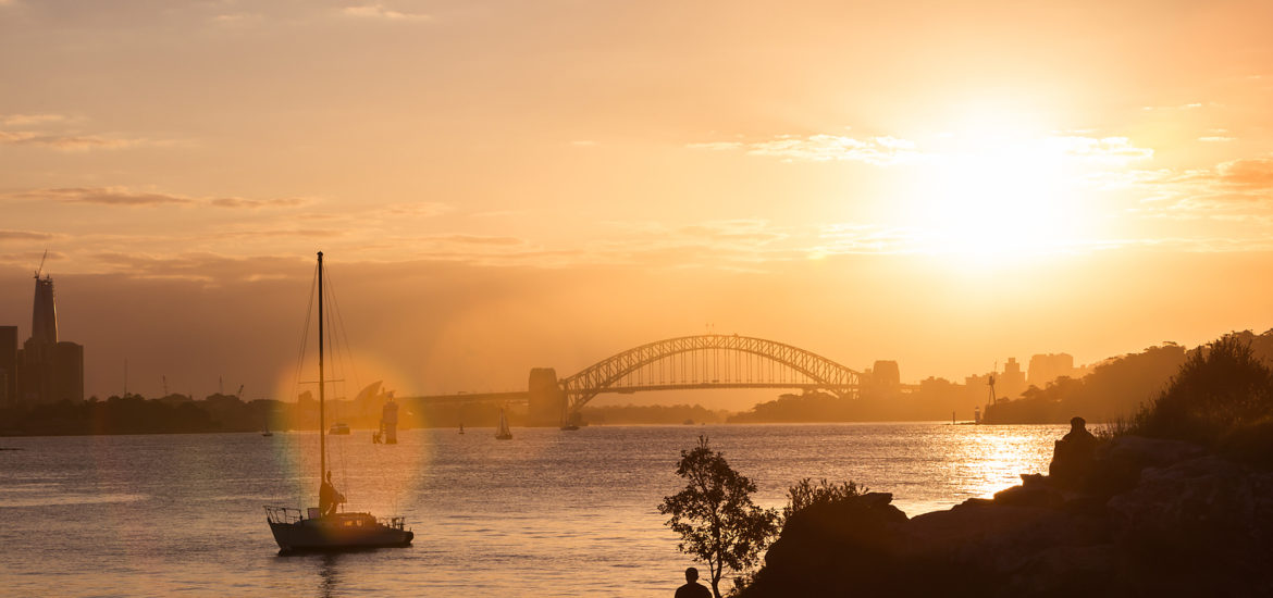 Sunset over Sydney Harbour fine art print, acrylic wall art for home and office decor, ready to hang, featuring a vibrant sunset with a yacht and silhouettes.