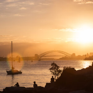 Sunset over Sydney Harbour fine art print, acrylic wall art for home and office decor, ready to hang, featuring a vibrant sunset with a yacht and silhouettes.