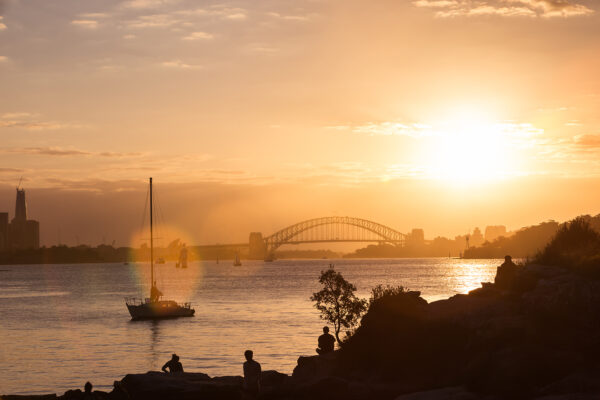 Sunset over Sydney Harbour fine art print, acrylic wall art for home and office decor, ready to hang, featuring a vibrant sunset with a yacht and silhouettes.