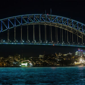 Vivid Sydney, a close up of the Harbour Bridge showing the north Sydney Skyline and Luna Park