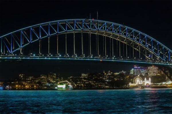 Vivid Sydney, a close up of the Harbour Bridge showing the north Sydney Skyline and Luna Park. Wall Art Prints for home and office decor.