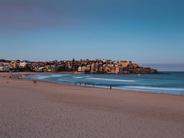 Bondi Beach empty, showing showing the apartments at Ben Buckler.