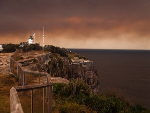 The Sydney Cliff Walk at Christison Park surrounded by orange bushfire smoke, Vaucluse, Sydney.