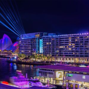 Vivid Sydney light display over the Opera House and The Bennelong Apartments, Circular Quay, Sydney.