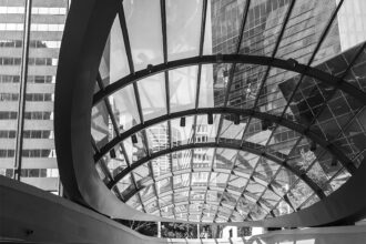 Black and white photograph of Wynyard Walk canopy in Sydney, featuring modern architectural lines – wall art print for home or office decor.