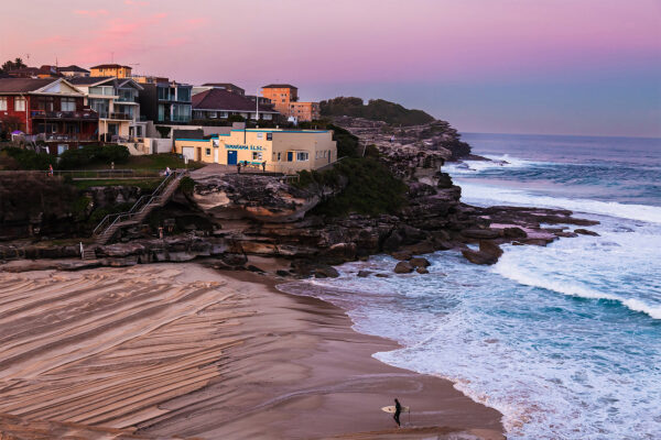 Wall art photo print of a pink sunset over Tamarama Beach, perfect for adding a serene coastal vibe to any room.