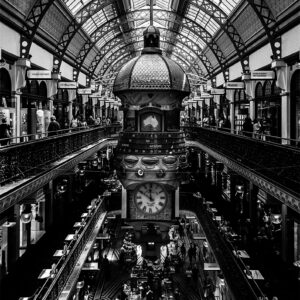 Interior of Queen Victoria Building showing the Great Australian Clock in black and white.