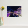 Matte print of Bennelong Apartments with a vivid purple glow, part of the Vivid Sydney collection, ideal for elegant home and office decor.