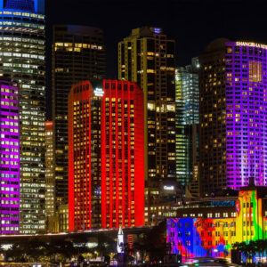 Vivid Urban Glow featuring multi-colored CBD skyscrapers, architectural wall art for modern office and home decor.