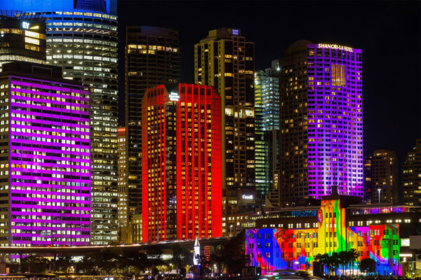 Vivid Urban Glow featuring multi-colored CBD skyscrapers, architectural wall art for modern office and home decor.