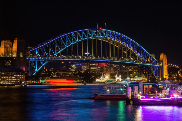 Vivid Sydney Lights featuring the illuminated Sydney Harbour Bridge, perfect for home and office wall decor. Bright and vibrant colors capturing the energy of Sydney’s iconic landmarks during the famous light festival.