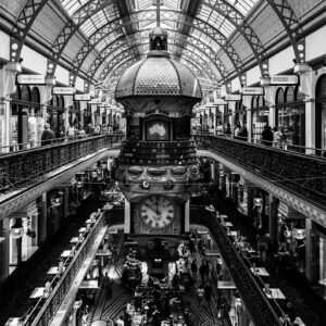 Elegant black and white print of the Queen Victoria Building in Sydney, captured from a street-level front view, highlighting its grand Romanesque architecture — perfect for stylish wall decor and interior design.