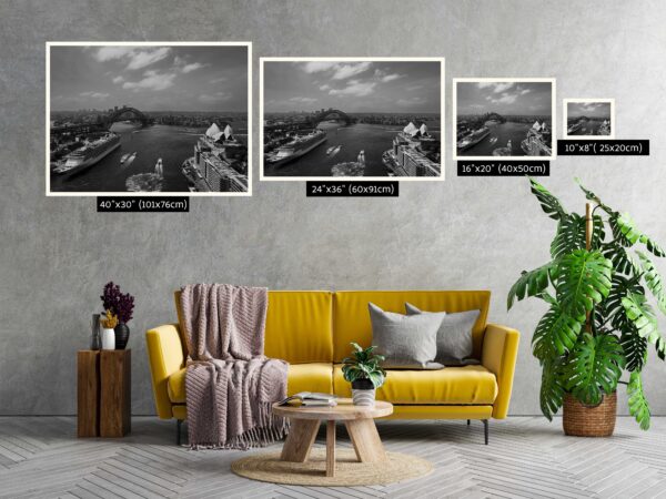 Black and white photograph of the iconic Sydney Harbour skyline, featuring the Sydney Opera House and Harbour Bridge against a timeless backdrop. Perfect as wall decor, this art print captures the city's architectural beauty and urban landscape in a classic monochrome style.