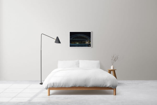 Wall art print of Sydney Harbour Bridge illuminated with vivid lights at night