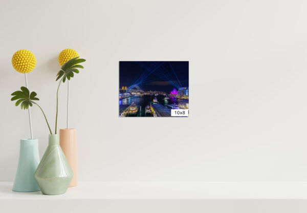 Vivid Sydney wall art print featuring Circular Quay illuminated by colorful light projections, showcasing Harbour Bridge and Opera House.