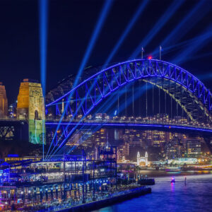 Colorful Vivid Sydney Harbour Bridge illuminated at night, captured in a high-quality wall art print