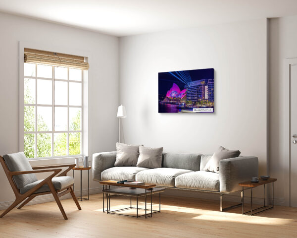 Vivid Sydney fine art print featuring the Sydney Opera House illuminated with pink lights and laser projections, viewed from Bennelong Apartments.