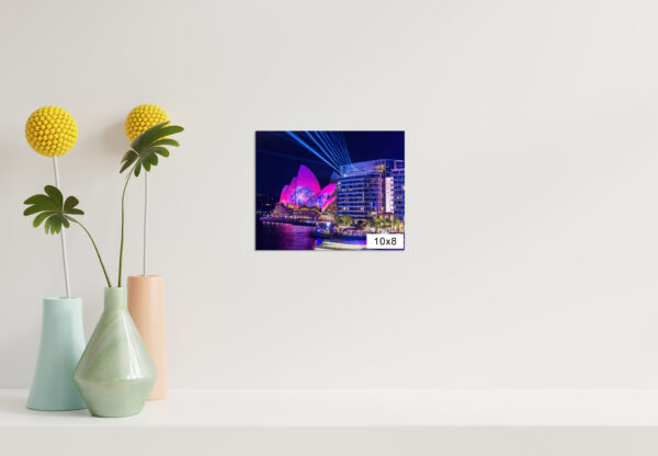 Vivid Sydney fine art print featuring the Sydney Opera House illuminated with pink lights and laser projections, viewed from Bennelong Apartments.