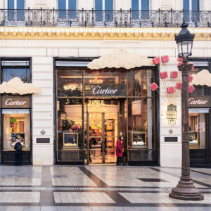 Photograph of the Cartier boutique on the Champs-Élysées in Paris, showing elegant architecture with no people in the foreground.