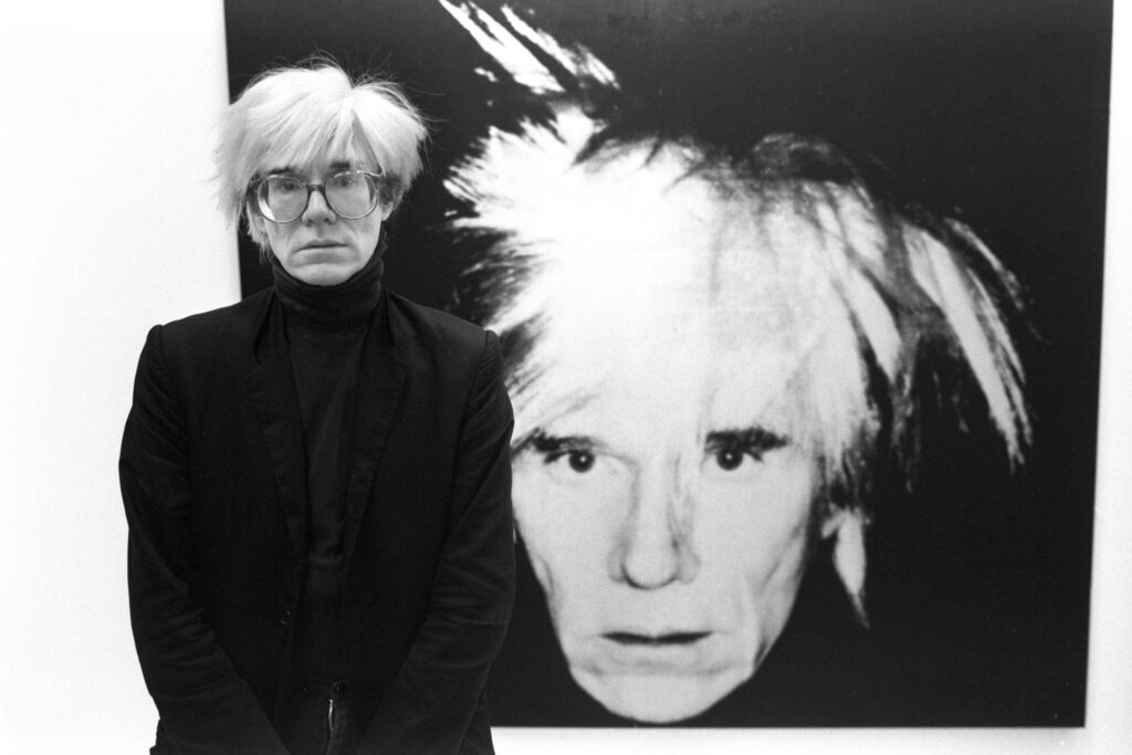 Portrait of Andy Warhol at the opening of his self-portrait exhibition at Anthony d'Offay Gallery, London, 1986.