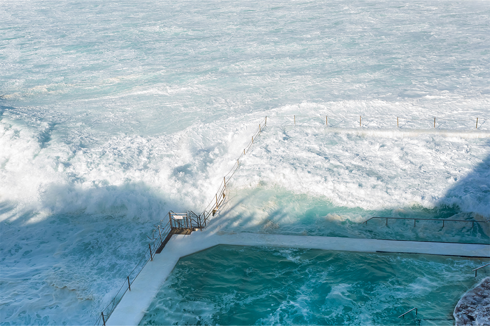 Bondi Icebergs ocean pool with waves crashing over edge, Sydney coastal photography print